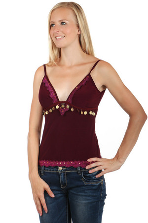 Untraditional decorated ladies tank top. Spaghetti straps. Decorations vary by color. Material: 92% polyester, 8% elastane.