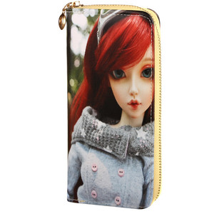 Women's wallet with 3D doll image. Includes a hand strap and lots of pockets. Size: 9cm, w 19cm, 3cm thick Material: