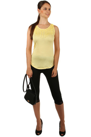 Women's elegant longer cut. The round neck is decorated with fringes. The upper part is completed with lace at the top.
