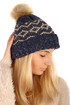 Women's warm knitted hat with pattern and pompon