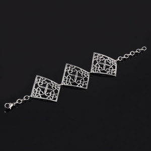 Bracelet made of surgical steel with large ornaments. Dimensions: length adjustable 18-23,5cm, width 47mm, square 45mm,