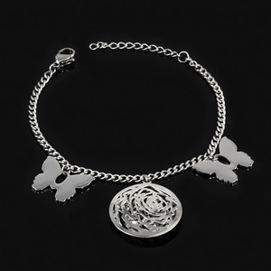 Bracelet made of surgical steel butterflies and wheels. Dimensions: length adjustable 17,5-21cm, width 3mm, butterfly 19 x