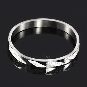 Women's circular steel bracelet decorated with rhinestones. Material surgical steel. diameter 6,2cm, width 8mm, thickness