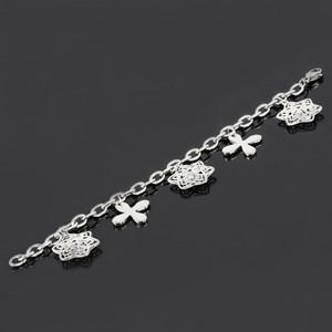 Bracelet made of surgical steel star and flower. Length 20cm, mesh size 8x5mm, star 25x20mm - inside stones, flower 22x22mm.