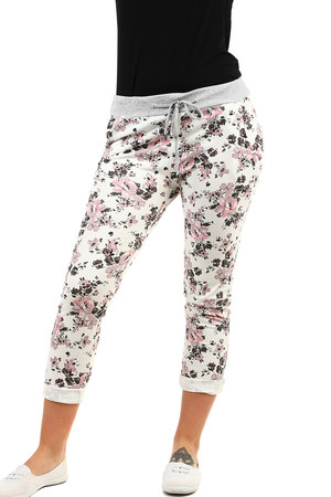 Women's slim fit sweatpants in shortened length, with floral print. Material: 100% cotton. Import: Italy
