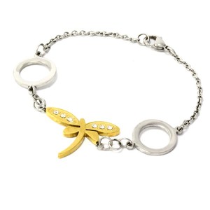 Narrow surgical steel bracelet with dragonfly in gold color. dimension of the dragonfly 30mm x 20mm length adjustable 0 -