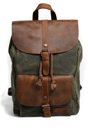 Classic unisex backpack a combination of waterproof canvas and genuine leather main pocket with a decorative buckle for
