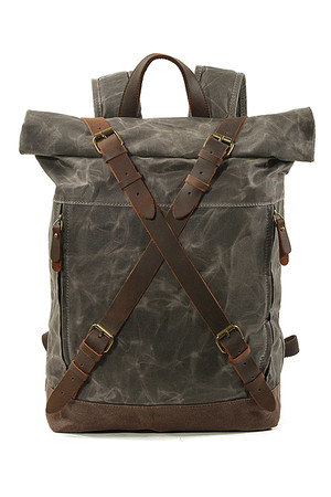 Retro roll-top backpack made of canvas main compartment with a buckle for patents and straps of genuine leather with classic