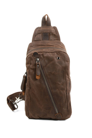 Small canvas backpack on one shoulder with genuine cowhide details the main compartment is zipped inside is a single