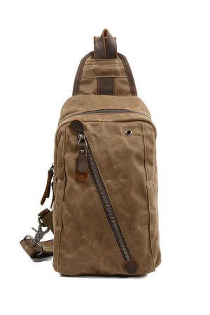 Small canvas backpack on one shoulder with genuine cowhide details the main compartment is zipped inside is a single