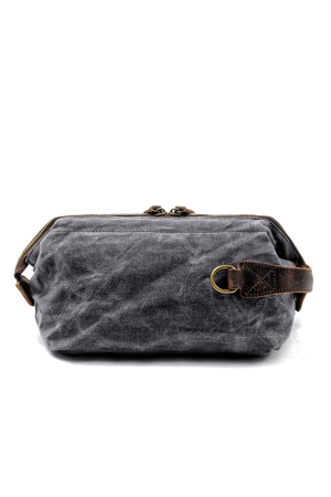 Large canvas cosmetic bag in retro design with genuine cowhide leather details the main compartment fastens with a zipper on