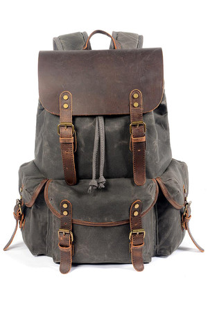 Big retro canvas backpack with leather details details and genuine leather straps the main compartment with drawstring with