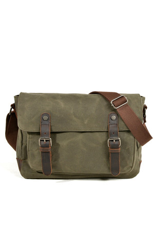 Canvas shoulder bag with leather details in a fashionable retro design the main compartment is zipped, has a flap with