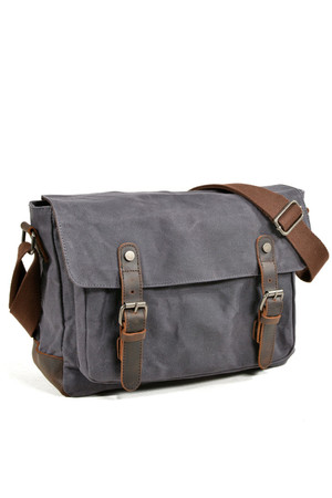 Canvas shoulder bag with leather details in a fashionable retro design the main compartment is zipped, has a flap with
