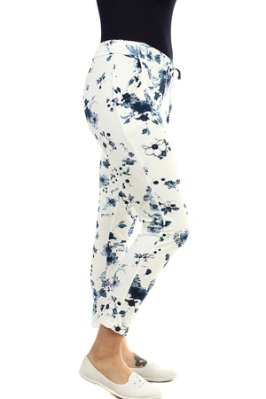White women's 7/8 sweatpants with a blue flower pattern shortened leg length in creamy white with a colored ornament elastic
