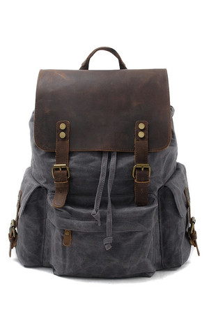 Retro backpack made of waxed canvas interior storage with lining padded tablet or notebook compartment, protected by rubber