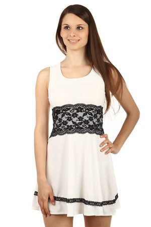 Amazing dress with lace at the waist. Lanyard. At the bottom of the dress is a narrow lace belt. Zip fastening at the back.