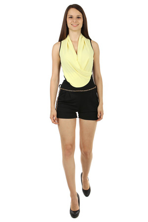 Stylish ladies' overall with a wraparound effect and a chain strap. The overall has pockets. Import: Italy Material: 94%