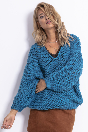 Women's knitted sweater with a coarse binding V - neckline low shoulder seams sleeves bordered by a cuff pleasant on the skin