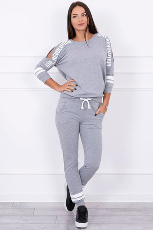 Original women's tracksuit with slits on the sleeves and a simple print. two-piece set with a high proportion of cotton