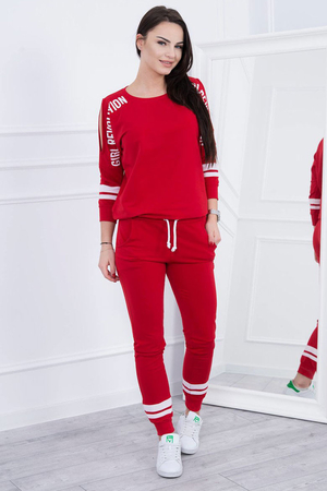 Original women's tracksuit with slits on the sleeves and a simple print. two-piece set with a high proportion of cotton