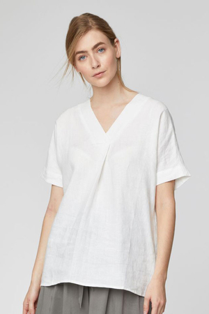 Ladies white hemp blouse with V-neck small fold at the bottom of the neckline breathable and soft made of natural sustainable