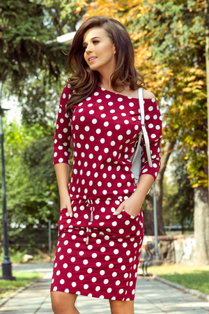 Beautiful lightweight women's dress with polka dot pattern wide boat neck 3/4 sleeves adjusts to the body covered cut two