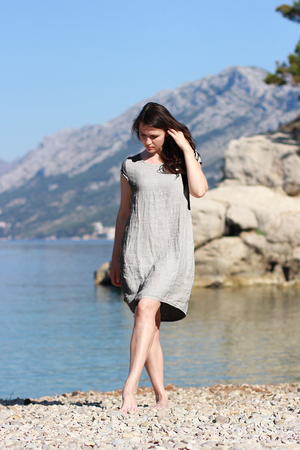 Timeless women's linen dress with pockets created for summer. one color design free air cut length above the knees boat
