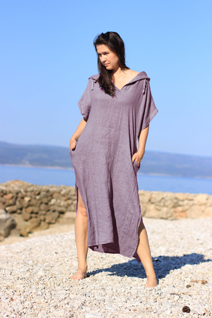 Airy women's maxi dress made of 100% linen one color design neckline to lowercase letter V at the back, a hood with a
