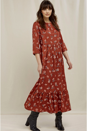 Women's long maxi dress with three-quarter sleeves with a ruffle on the skirt over the head button fastening at the neck