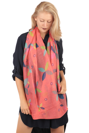 Coloured circular scarf very lightweight transparent from viscose coloured leaves on a solid colour background a chic and