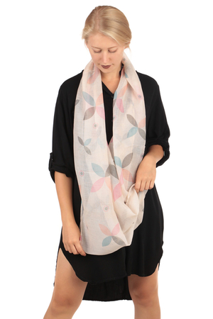 Coloured circular scarf very lightweight transparent from viscose coloured leaves on a solid colour background a chic and
