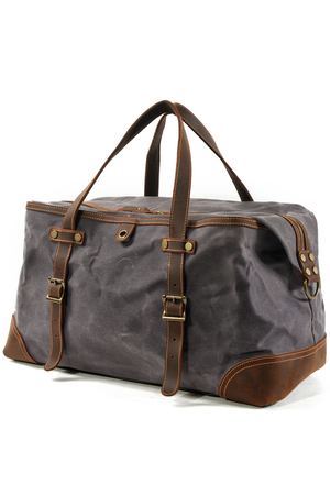 Travel bag made of waterproof canvas for hand and shoulder in a pleasant retro look main part with two-way metal zipper
