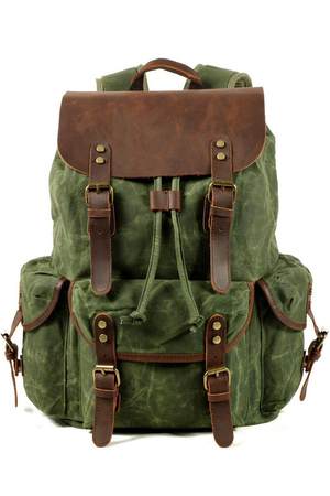 Big retro canvas backpack with leather details details and genuine leather straps the main compartment with drawstring with