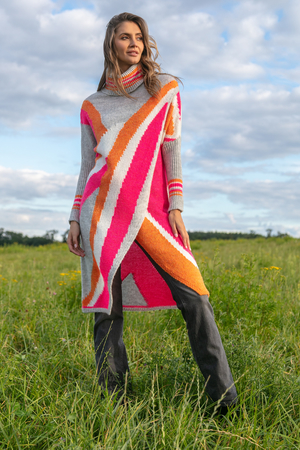 Long narrow poncho in multicolour design with turtleneck long sleeves sleeves finished with long cuff elasticated, does not