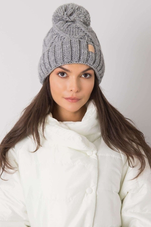 Women's pompom top hat monochrome distinctive, knitted pattern lined with smooth fleece with a touch of wool fashionable and